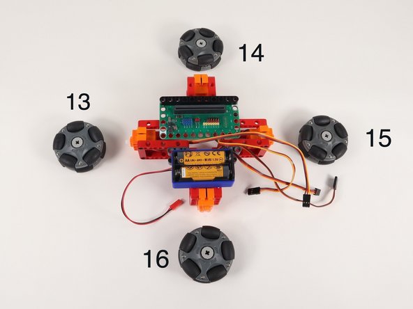 The numbers shown in the photo correspond to the pin each servo will connect to on the Bit Board.