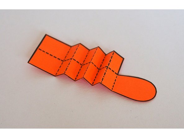 Prefold the legs. You don't have to do this, but the template lines will be hidden on the inside later. (Alternatively, you can fold the leg so the template lines are visible in the final version).
