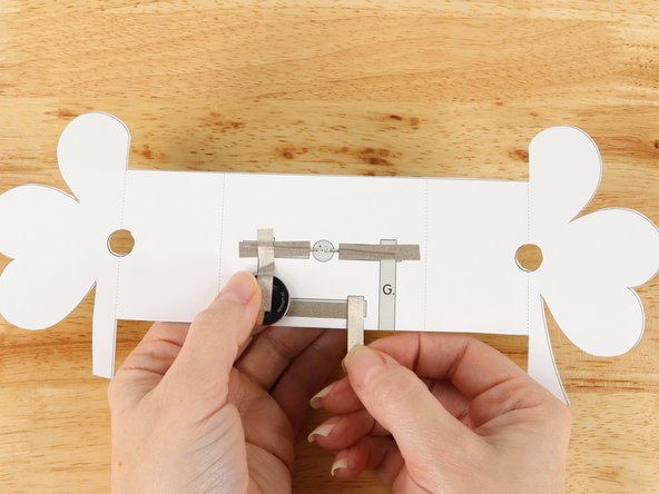 Add Maker Tape to tape path F.  This piece of Maker Tape will overlap with the right end of tape path C and wrap around the bottom of the project to the front side.