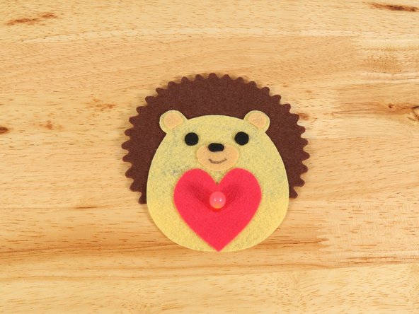 Use a black permanent marker to draw a mouth on the Hedgehog.