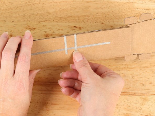 Wrap the tape around to the back of the neck and connect it to the ground pathway.