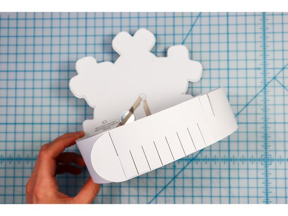 Interlock the slits in two places to create the size that works for your head.