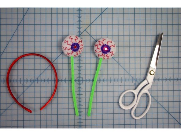 Insert the ends of the pipe cleaners into each of the styrofoam balls.