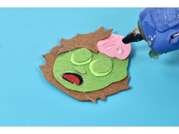 Add a squiggle of hot glue to finish off the brain! Dont touch it until it's fully hardened to allow it to maintain the shape.