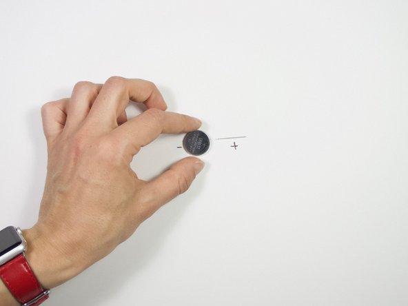 Remember which leg is positive (the long one) and negative (the short one). Fold the legs flat against the poster in opposite directions.