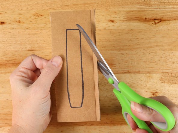 In this guide we used the lid to a box of paper (that's why one side is brown and the other is white.) You can use any cardboard you have around. Cereal boxes would also work.