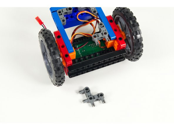 Turn the Rover upside down. We'll add two 90 degree connectors to the blue rear stabilizer beams as show.