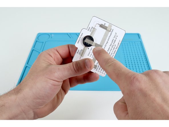 Measure, cut, peel and stick the final tape segment as shown on the diagram. At this point, the LED(s) should turn on.