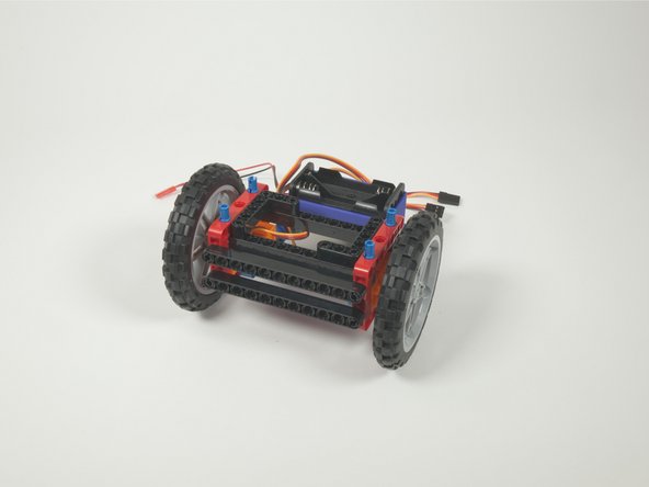 We've already got four blue pins sticking out of the top that we added in Step 8. The Bit Board will fit right onto those pins.