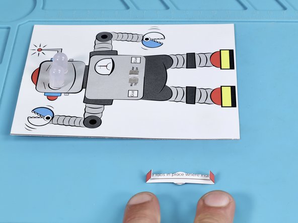 Fold the edges of the belt on the dotted lines found on the font of the belt.  Fold AWAY from the front TOWARD the back.