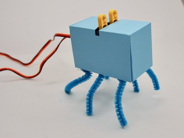 I found it easiest to disconnect the Bit Board while attaching the legs. If you do that, make sure to mark which servo attaches to which pin so you don't swap the connections by accident.