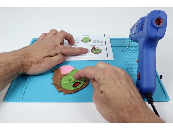 Add a squiggle of hot glue to finish off the brain! Dont touch it until it's fully hardened to allow it to maintain the shape.