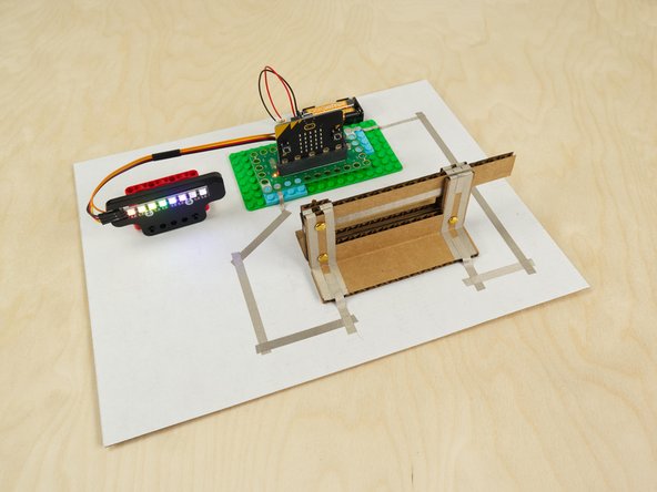 Since the Cardboard Knife Switch is a functional switch we can use it anywhere we might use a switch, including in a micro:bit project!