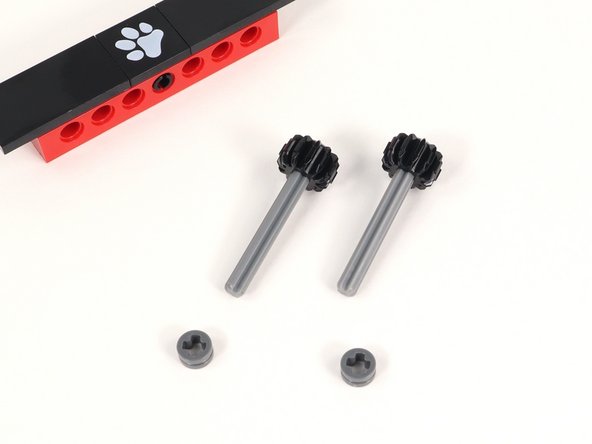 Add a half bushing to each axle and push it all the way down to the gear.