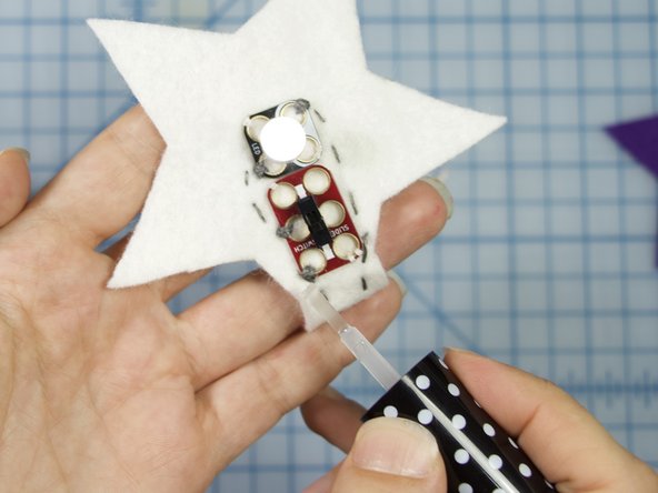 Tip: Be sure that the thread doesn't go underneath the switch component so that the metal pads are not connected accidentally.