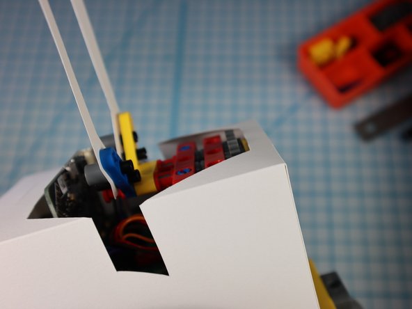 Turn on the bot and test that the arms are moving up and down as expected. Adjust the gears as needed.