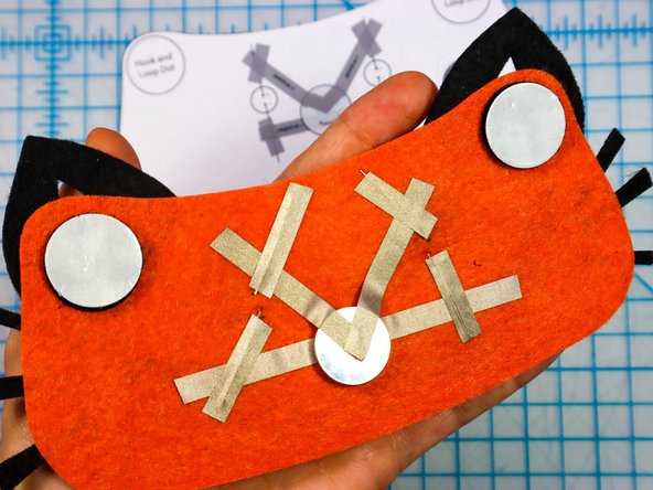 Then, peel the paper backing off of the other side and stick the design to the hat.