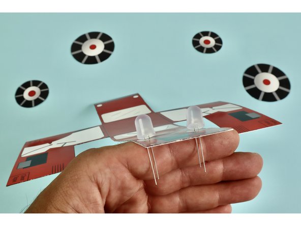 The Long LED Leg is Positive and needs to go in the hole labeled with +. The Short LED Leg is Negative and needs to go in the hole labeled -.