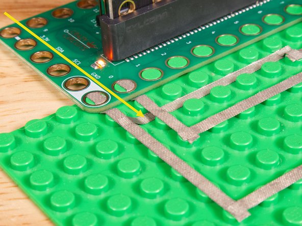 The LED will connect to Pin 8 and to Ground (GND) BUT! We're going to use the &quot;gutter&quot; between the LEGO baseplate studs so we can have two layers of tape that do not touch.