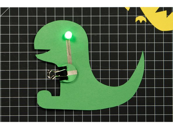 Use a binder clip to hold the battery in place.