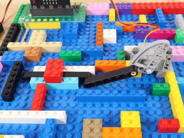 Test the gate by moving the ball bearing onto the two pieces of Maker Tape.