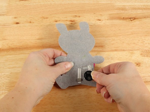 Make sure the Positive side of the Battery is facing upwards, with the Negative side stuck down to the tape.