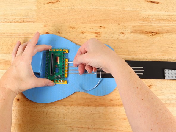 There will be four tape paths going up the neck. These paths cannot touch each other. Make sure to plan your space for each path accordingly.