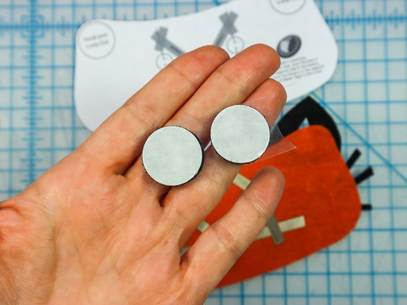 Peel the paper backing off of each hook and loop dot and place it where shown on the template.