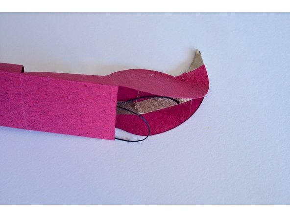 Tape one end of the string to the inside of the stinger.