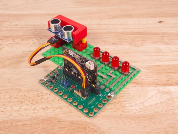 Plug the three-wire connector of the Crazy Circuits Ribbon Cable into the row with Pin 13 on the Bit Board. The wire colors should match the pin header colors, with S1 (yellow) going to the yellow pin.