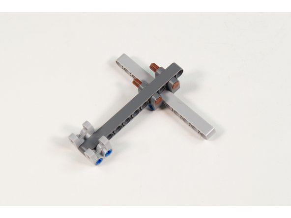 Add 2 LEGO Cross Block 2 x 2 Split (Axle / Twin Pin) as shown.
