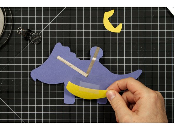 Add on the rest of the body parts using glue or tape.