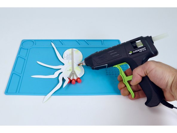Apply hot glue to the remaining side in the same way you did for the first legs template.