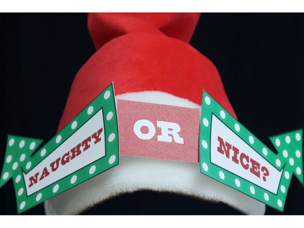 To complete the simple version of the hat, print and cut out the template, then hot glue the pieces in place, as shown.