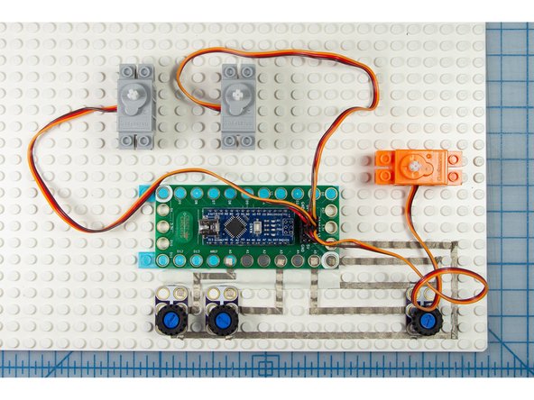 Connect the orange servo to D6 to control the spin of the egg.