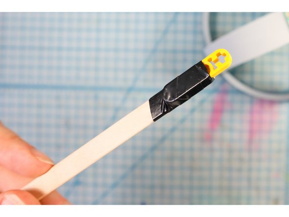 Then, we wrapped the two together with a piece of electric tape as shown.