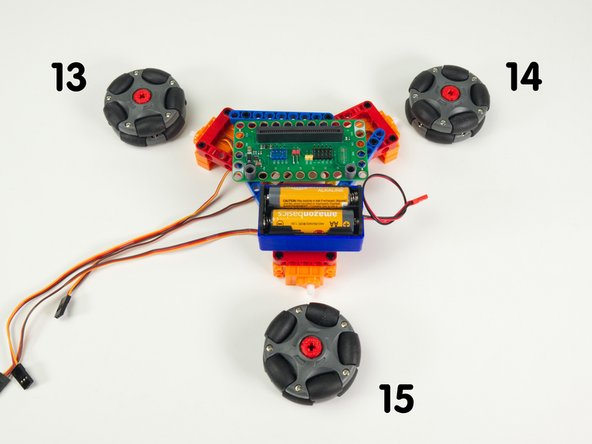 Turn the Rover around so it is facing away from you, as if you were driving it from inside or behind it. Note that we have a left wheel, right wheel, and a rear wheel.