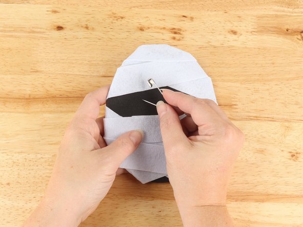 Use a safety pin or a push pin to poke four holes (two for each LED) through the felt for the LED legs to go through.