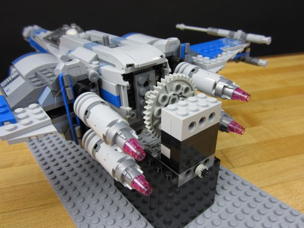 Place the X-Wing onto the base plate so that everything lines up.