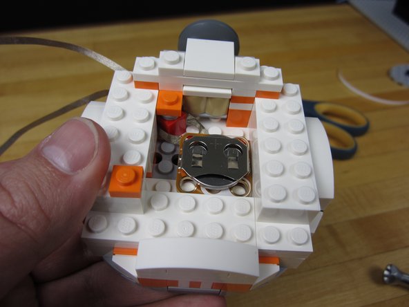 Place the holder inside the head, on top of the studs.