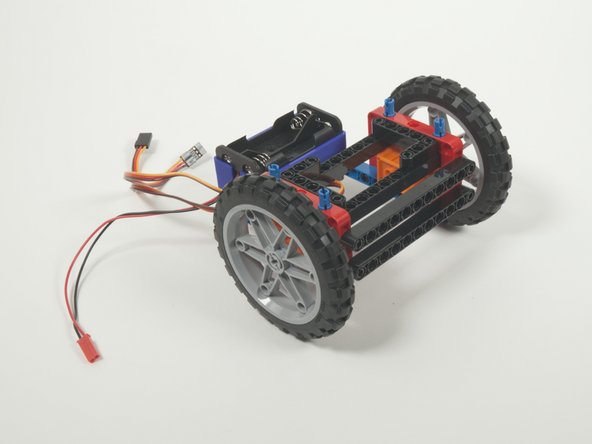 You can add the wheels now. They just press fit onto the servo shafts.