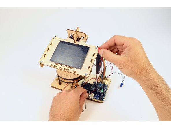 Insert the red wire from the battery holder into the screw terminal hole designated as POSITIVE. Use the screwdriver to tighten the set screw atop that red wire.