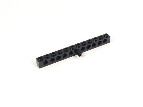 Add a black pin to the center hole of the 1x12 brick with holes.