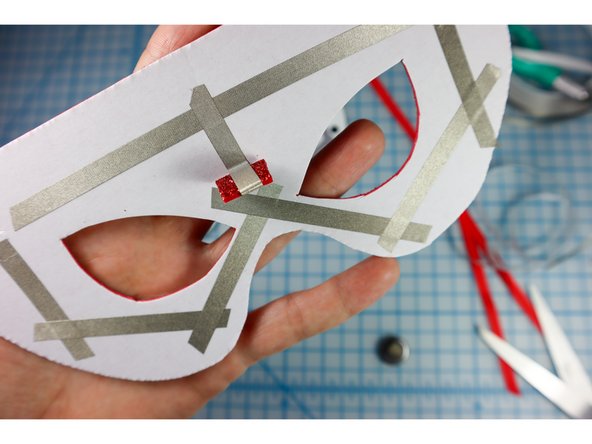 Add the piece to the mask where shown.