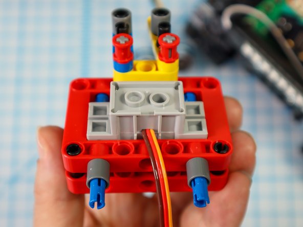 Place single beams on each of the pins.