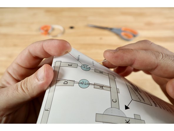 On the circuit side, fold the legs flat against the paper; away from one another as indicated on the diagram.