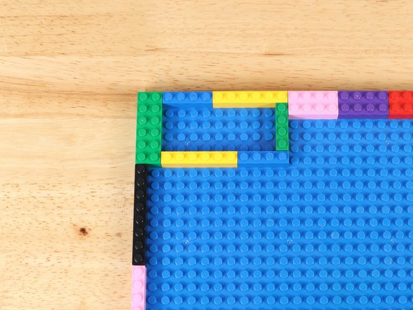 Arrange LEGO bricks in one corner to support a Crazy Circuits Bit Board.