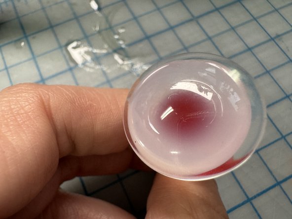 Wait until the glue is almost cool, then stick the LED to it.