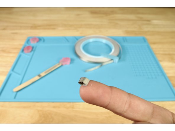 Cut another small piece of Maker Tape and turn it into a tape loop.