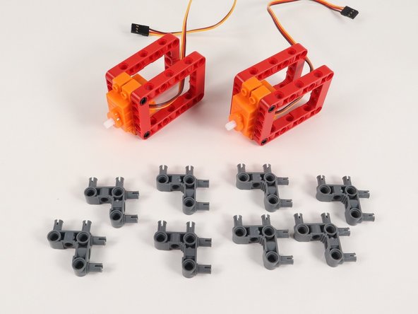 Add gray 90° connectors to the red frames as shown.